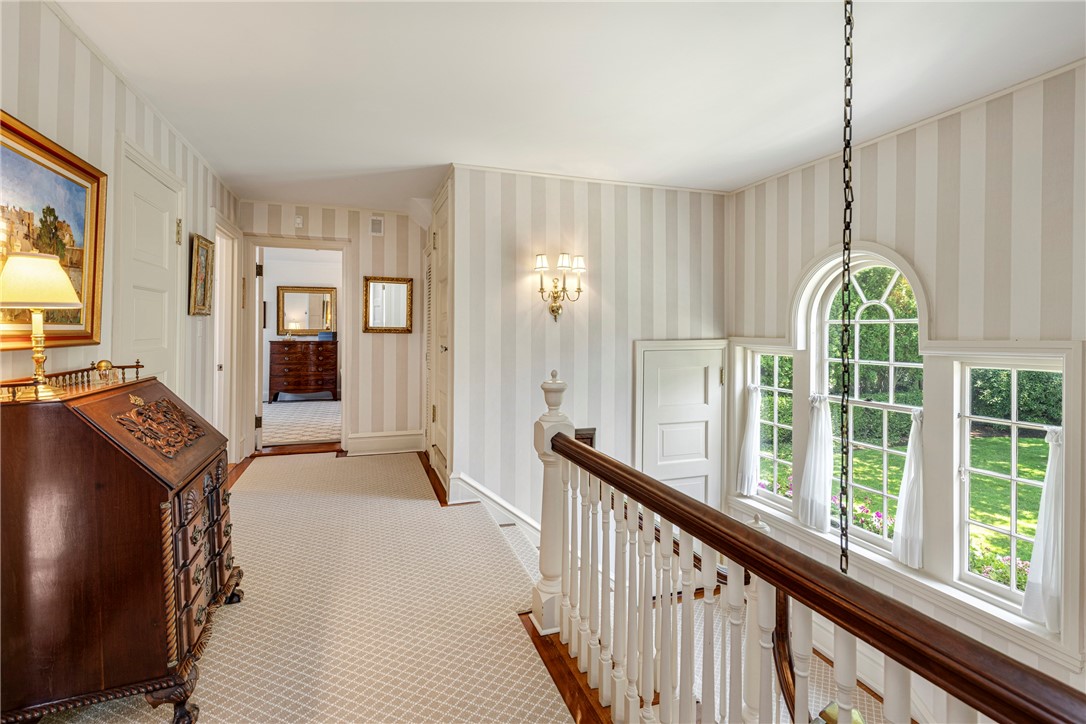 5 Waters Edge Road Westerly, RI 02891 - Photo 31 of 47 The grand staircase opens to a charming second floor landing.
