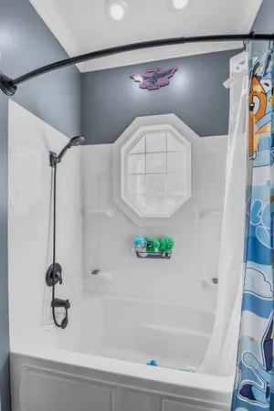 a bedroom with a bed and a table in it