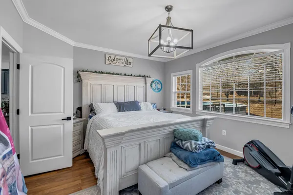 a view of a house with snow on the road