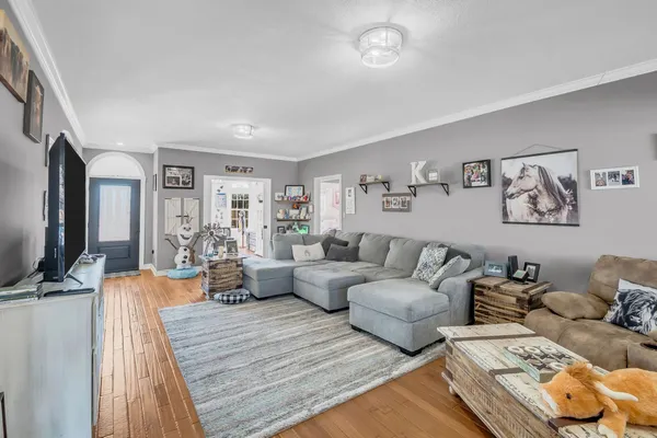 a very nice looking living room with furniture and a flat screen tv