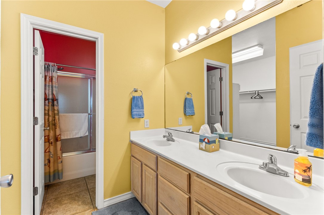 14427 Compass Street, Unit B14 Corpus Christi, TX 78418 - Photo 12 of 25 a bathroom with a sink and a mirror