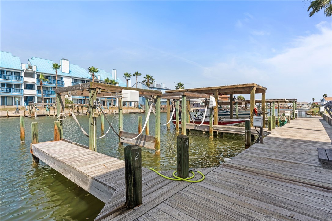 14427 Compass Street, Unit B14 Corpus Christi, TX 78418 - Photo 20 of 25 a view of a rooftop deck with chairs and ocean view