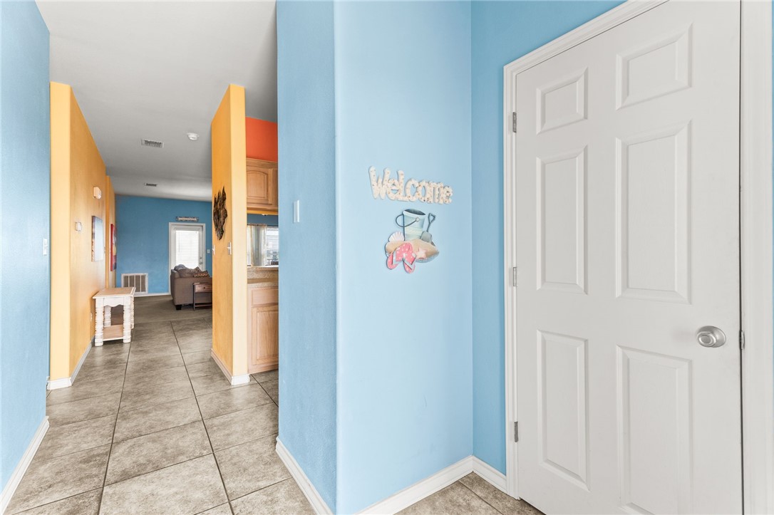 14427 Compass Street, Unit B14 Corpus Christi, TX 78418 - Photo 4 of 25 a view of a hallway with a livingroom and a bathroom