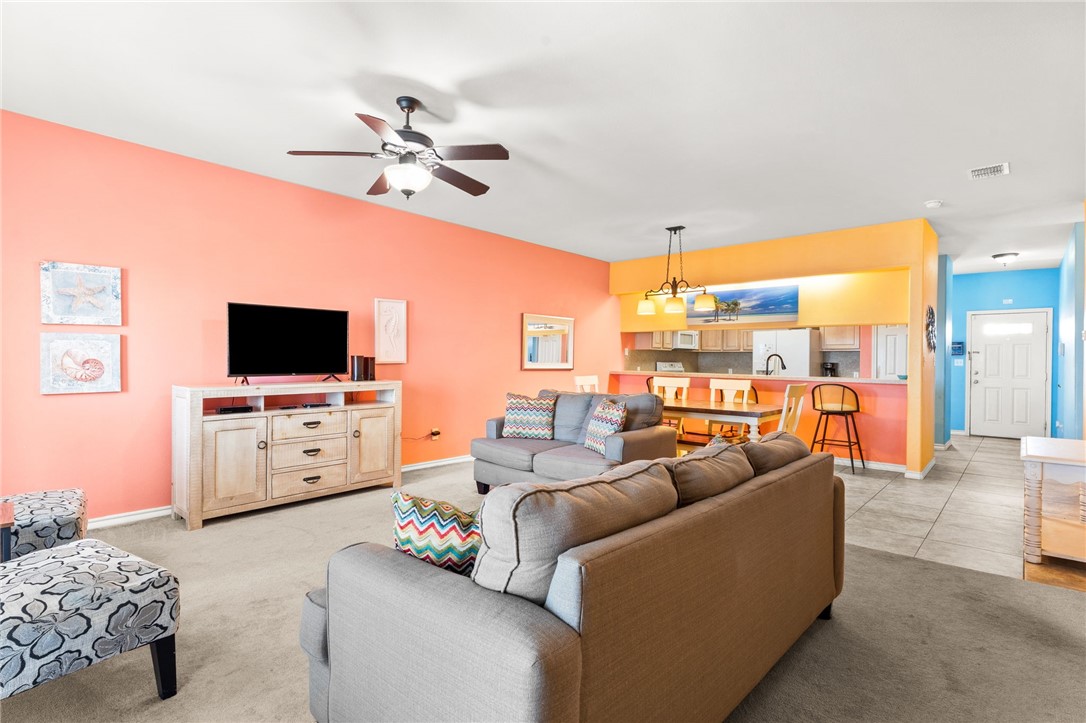 14427 Compass Street, Unit B14 Corpus Christi, TX 78418 - Photo 5 of 25 a living room with furniture and a flat screen tv