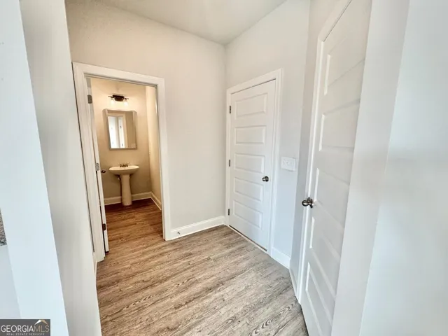 a view of a bathroom from a hallway