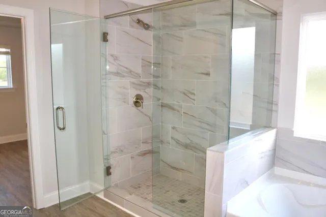 a bathroom with a shower and a toilet
