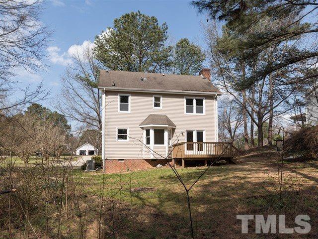 9312 Tallgrass Road Raleigh, NC 27603 - Photo 2 of 18 a front view of a house with garden