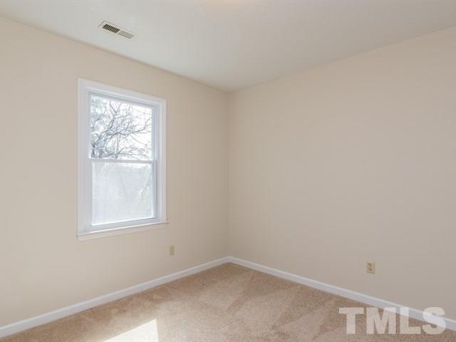9312 Tallgrass Road Raleigh, NC 27603 - Photo 17 of 18 an empty room with a window