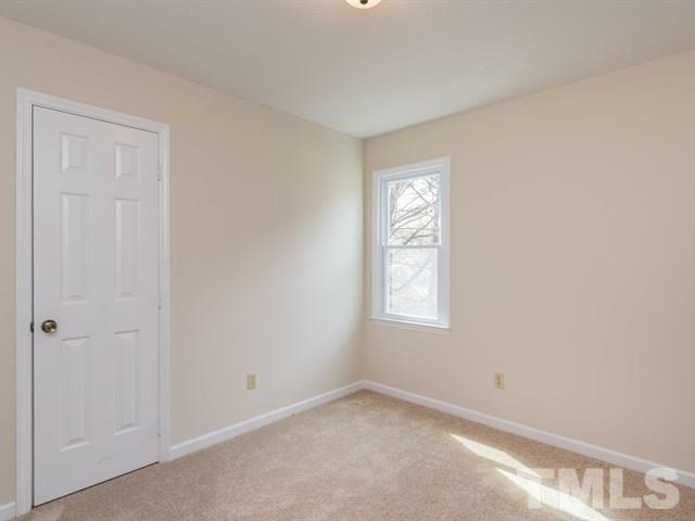 9312 Tallgrass Road Raleigh, NC 27603 - Photo 18 of 18 an empty room with windows
