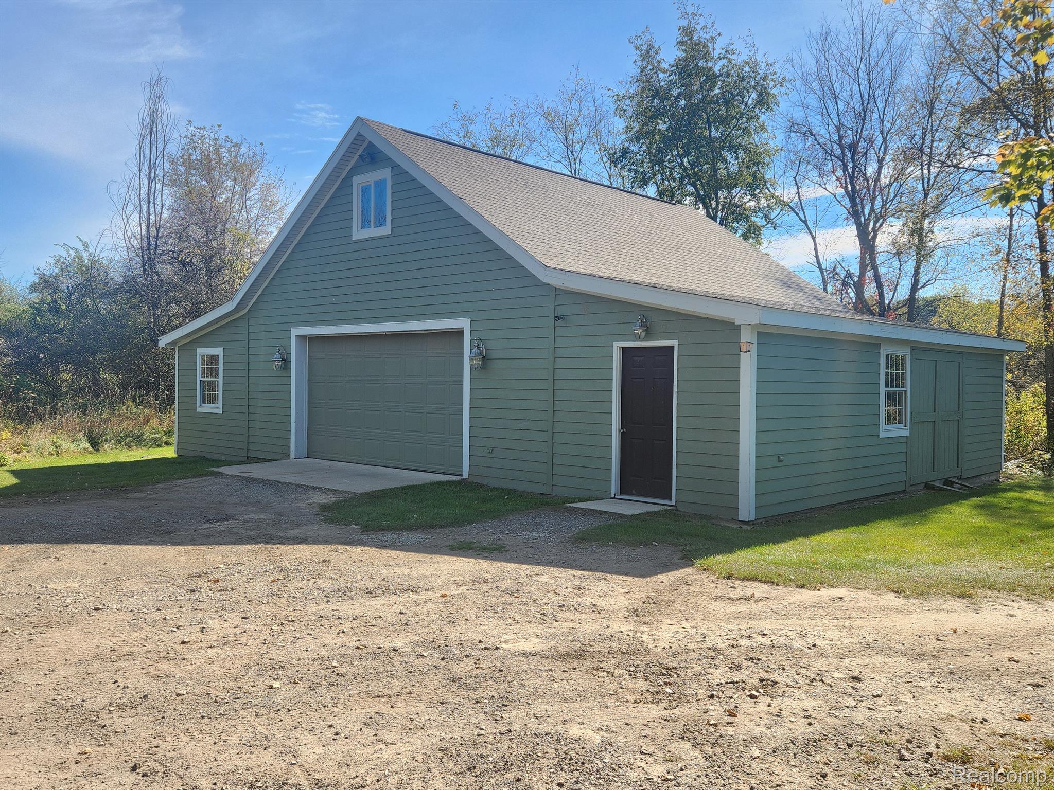 1900 East Marr Road Howell, MI 48855 - Photo 13 of 48 Pole barn w/ electricity, wood heat, A/C, concrete