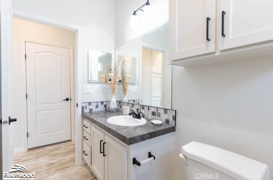 22678 La More Road Perris, CA 92570 - Photo 14 of 15 a bathroom with a sink and a toilet