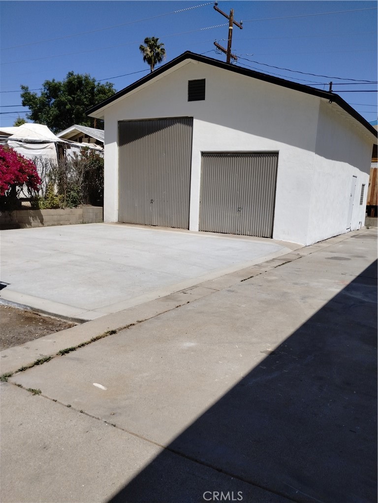 22678 La More Road Perris, CA 92570 - Photo 3 of 15 a front view of a house with a garage