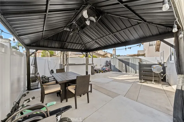 a view of outdoor space with table and chairs