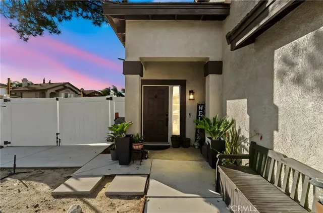 a view of a house with a potted plant