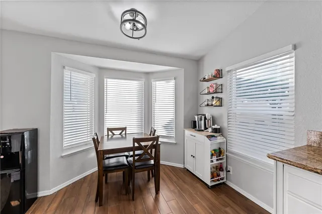 a view of a kitchen and dining room