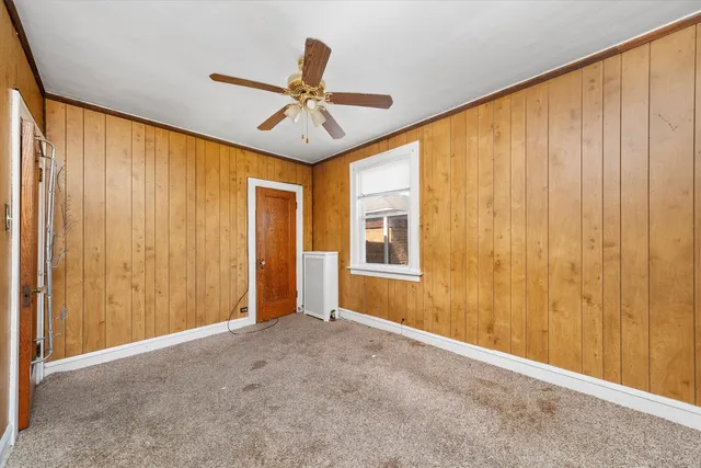 a view of an empty room and a window
