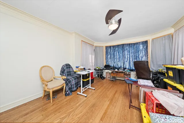 a workspace with furniture hardwood and a window