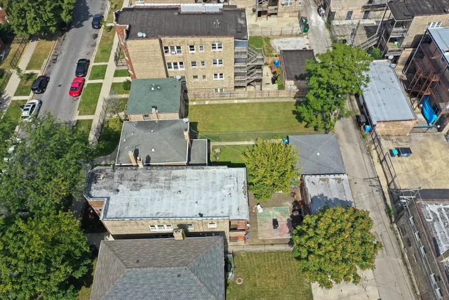 an aerial view of multiple houses with outdoor space