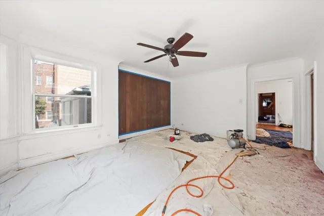 a bed room with a bed and a window