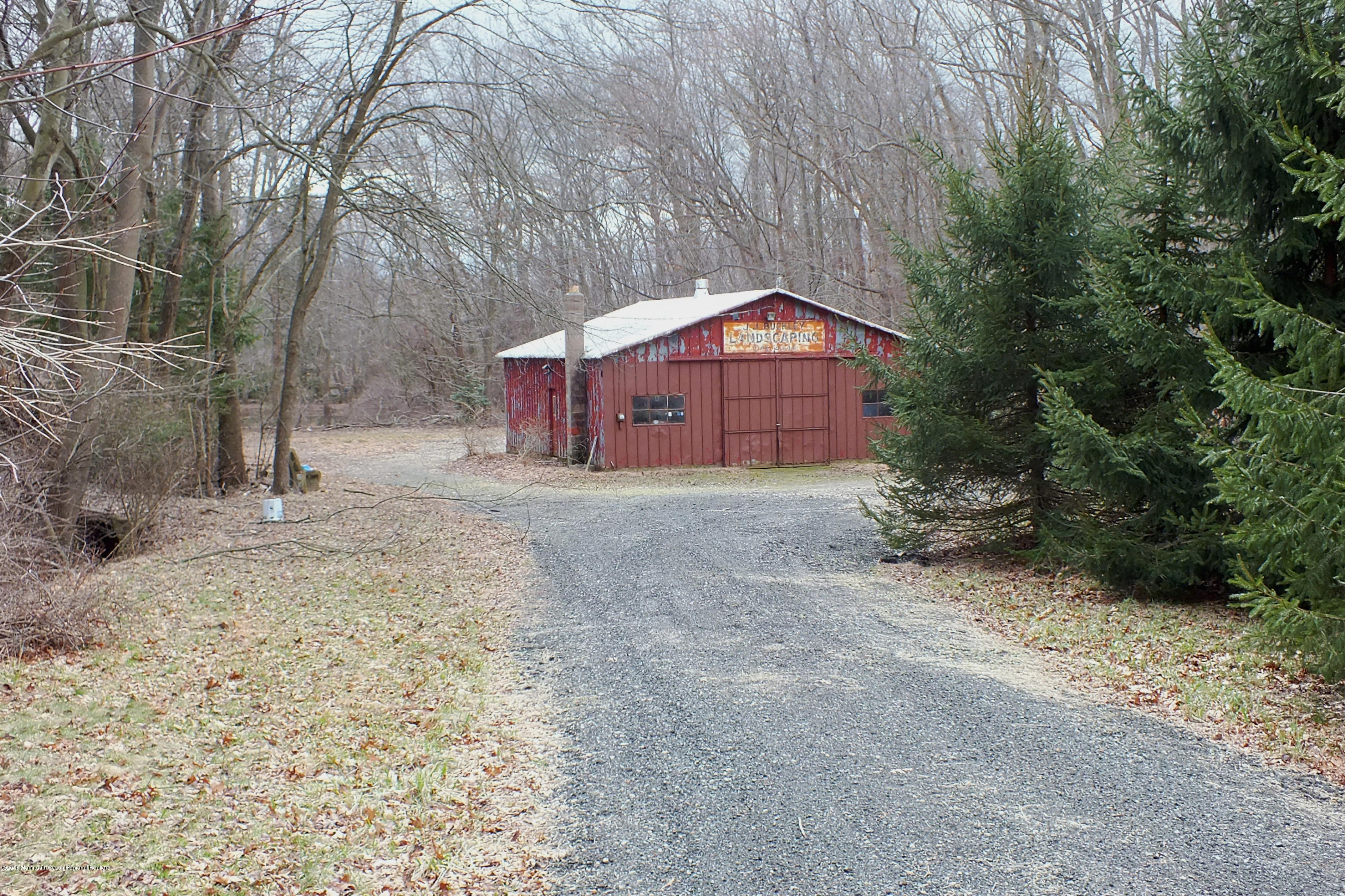 127 Crawfords Corner Road Holmdel, NJ 07733 - Photo 1 of 12 a view of a large house with a large tree and a yard