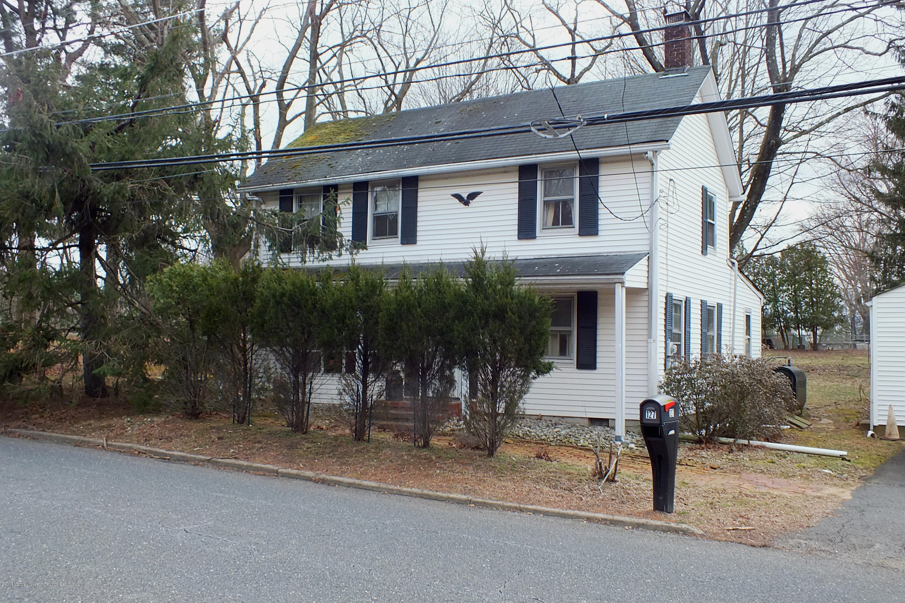 127 Crawfords Corner Road Holmdel, NJ 07733 - Photo 3 of 12 a front view of a house with garden