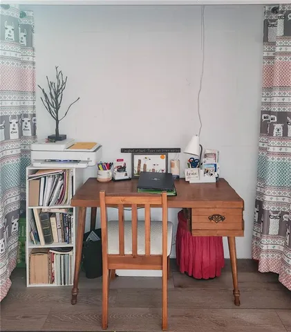 a bedroom with furniture and a book shelf