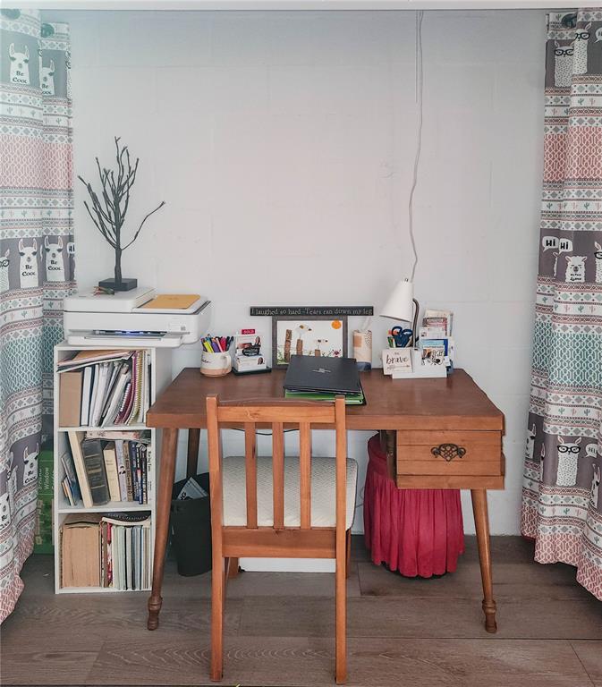 5052 Marsh Field Road, Unit 9 Sarasota, FL 34235 - Photo 4 of 15 a bedroom with furniture and a book shelf