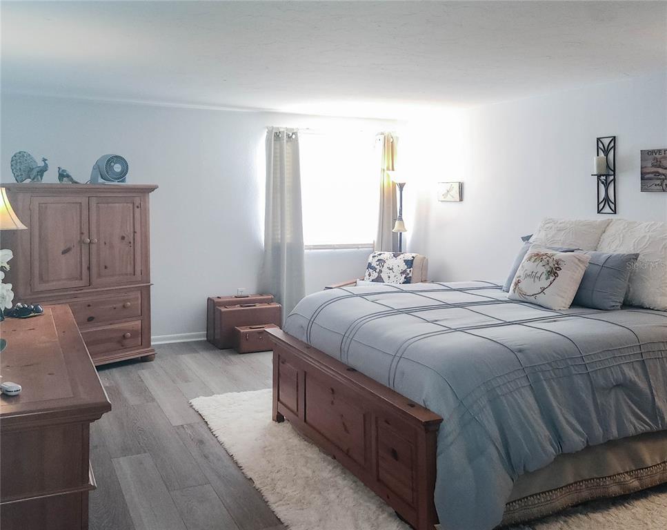 5052 Marsh Field Road, Unit 9 Sarasota, FL 34235 - Photo 5 of 15 a bedroom with a bed and a couch