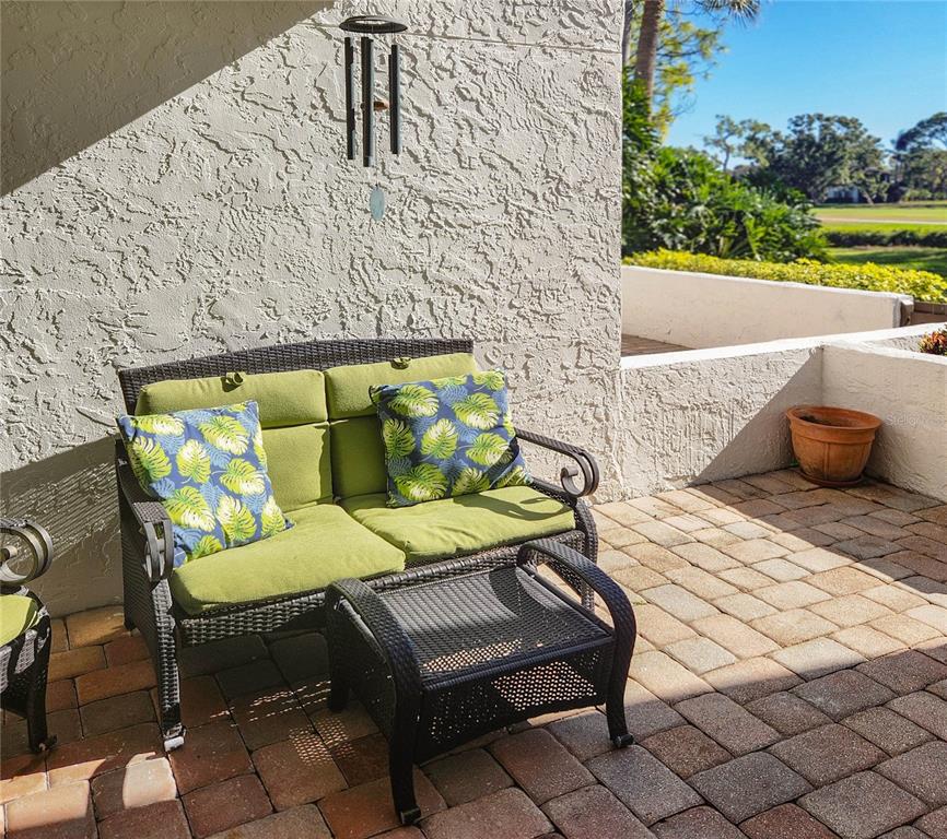 5052 Marsh Field Road, Unit 9 Sarasota, FL 34235 - Photo 9 of 15 a outdoor sitting area with a couch