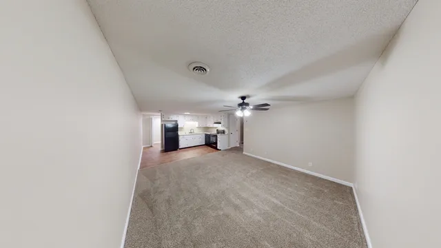 a view of empty room with windows