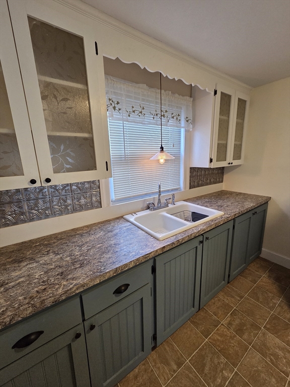 72 Barstow Street, Unit 1 Salem, MA 01970 - Photo 8 of 12 a bathroom with a granite countertop sink and a mirror