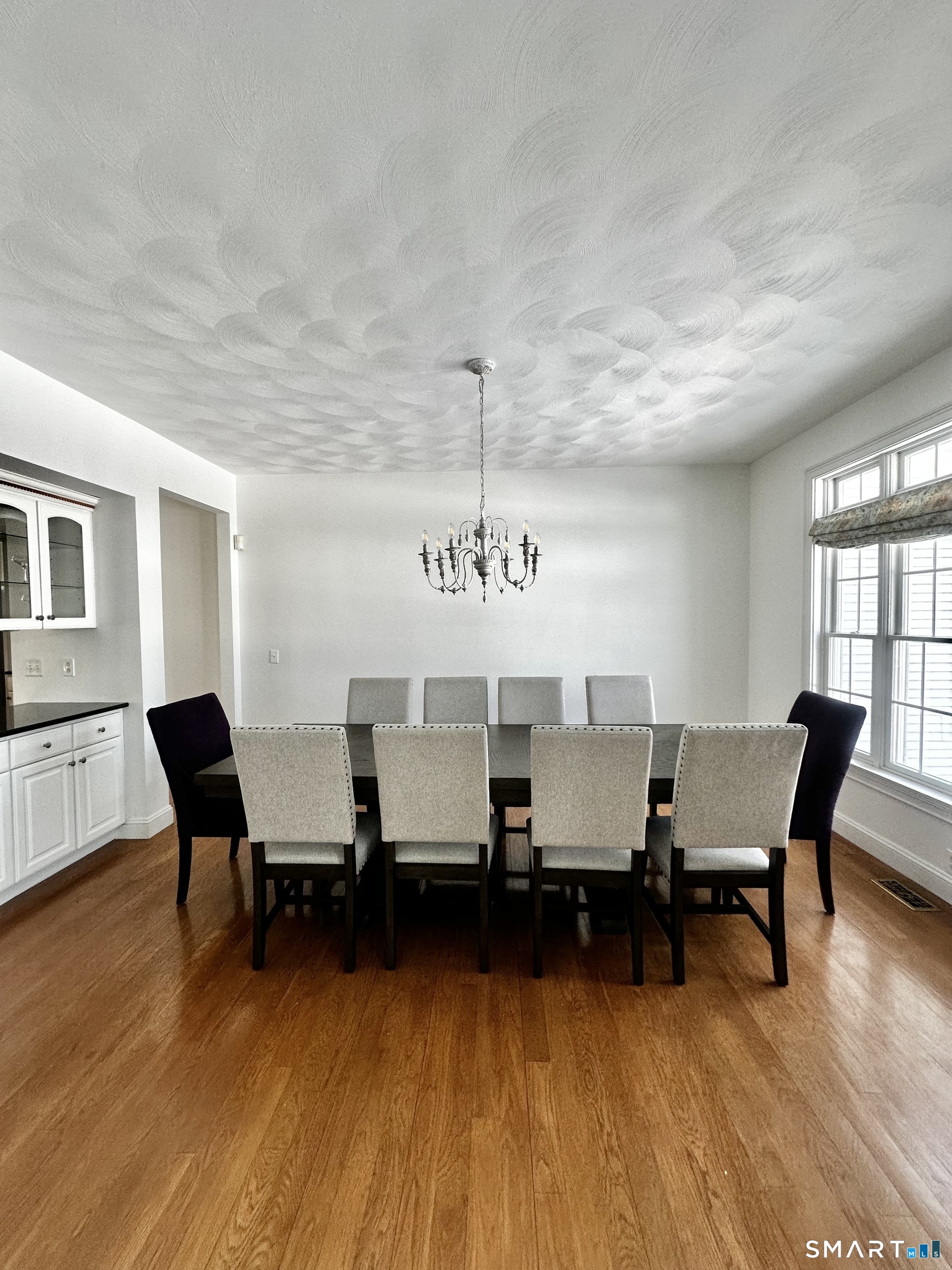 9 Leeward Lane Groton, CT 06340 - Photo 12 of 18 a living room with furniture and a wooden floor
