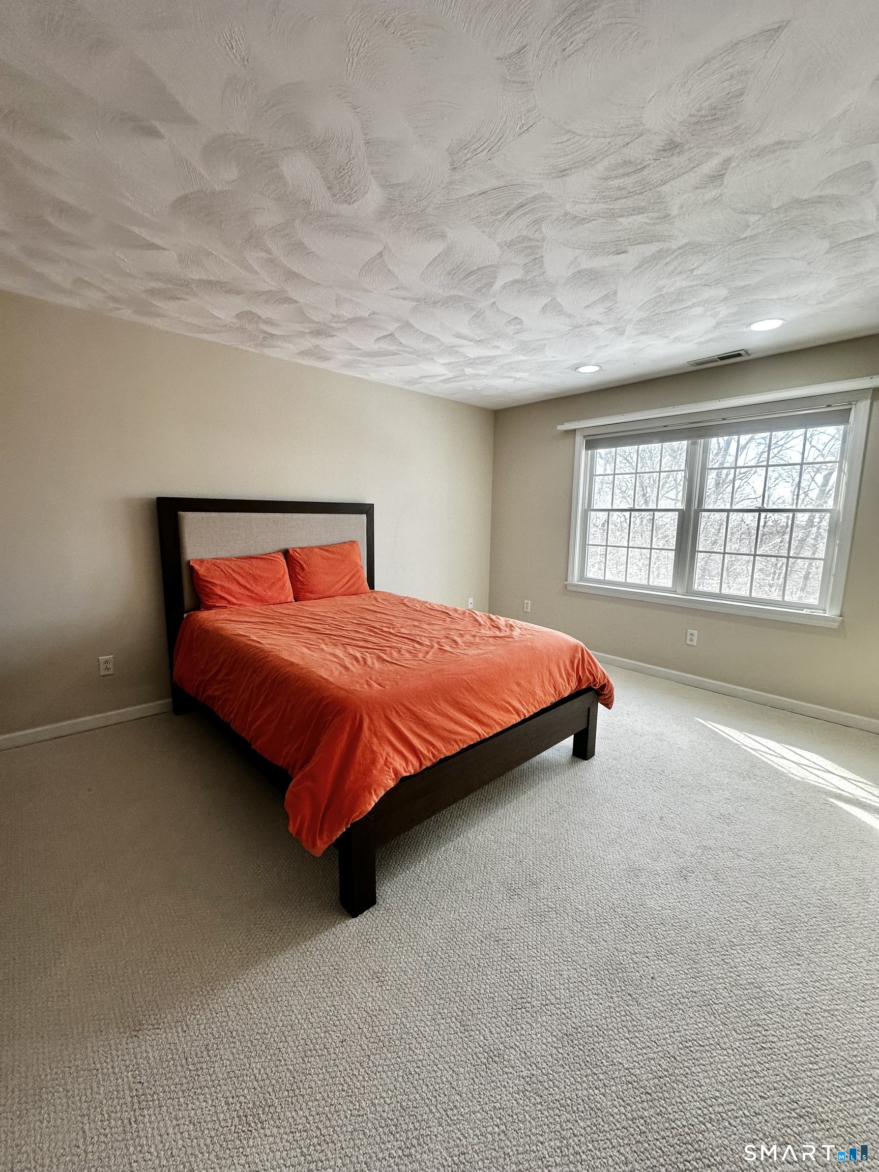 9 Leeward Lane Groton, CT 06340 - Photo 14 of 18 a bedroom with a bed and a large window
