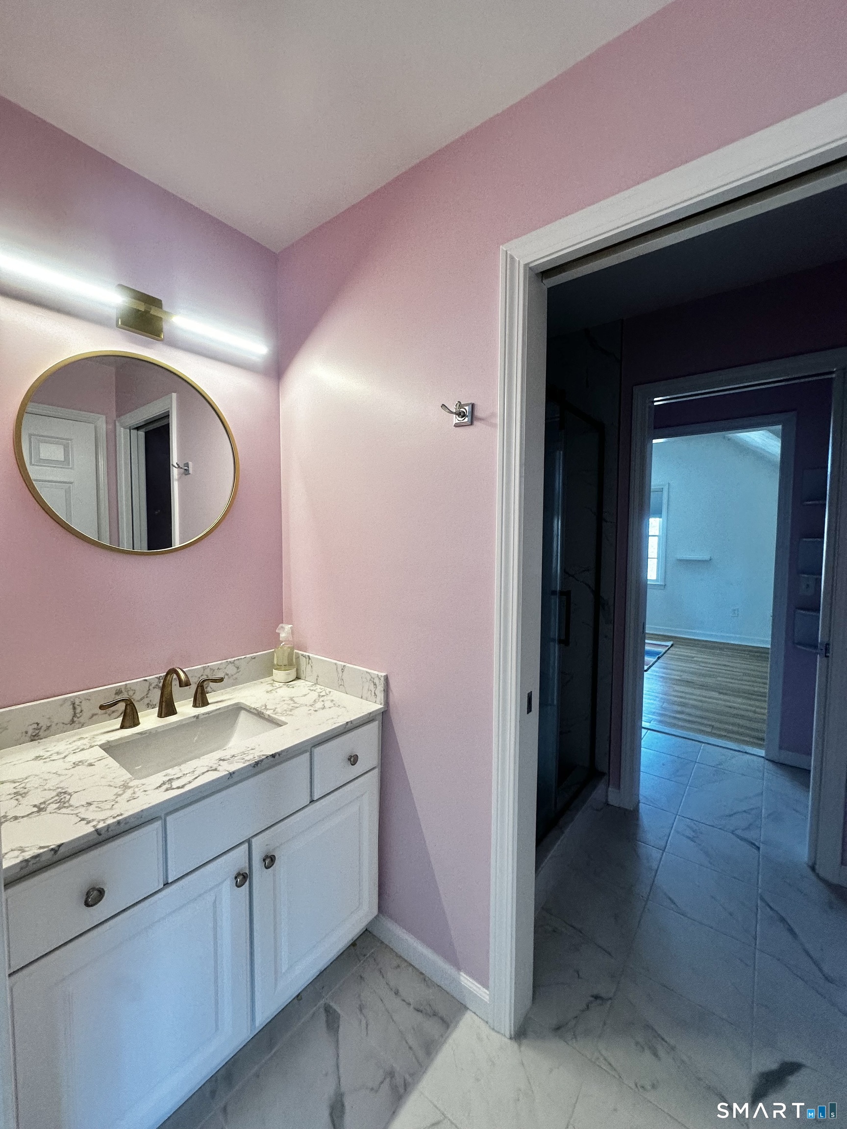9 Leeward Lane Groton, CT 06340 - Photo 16 of 18 a spacious bathroom with a granite countertop sink and a mirror