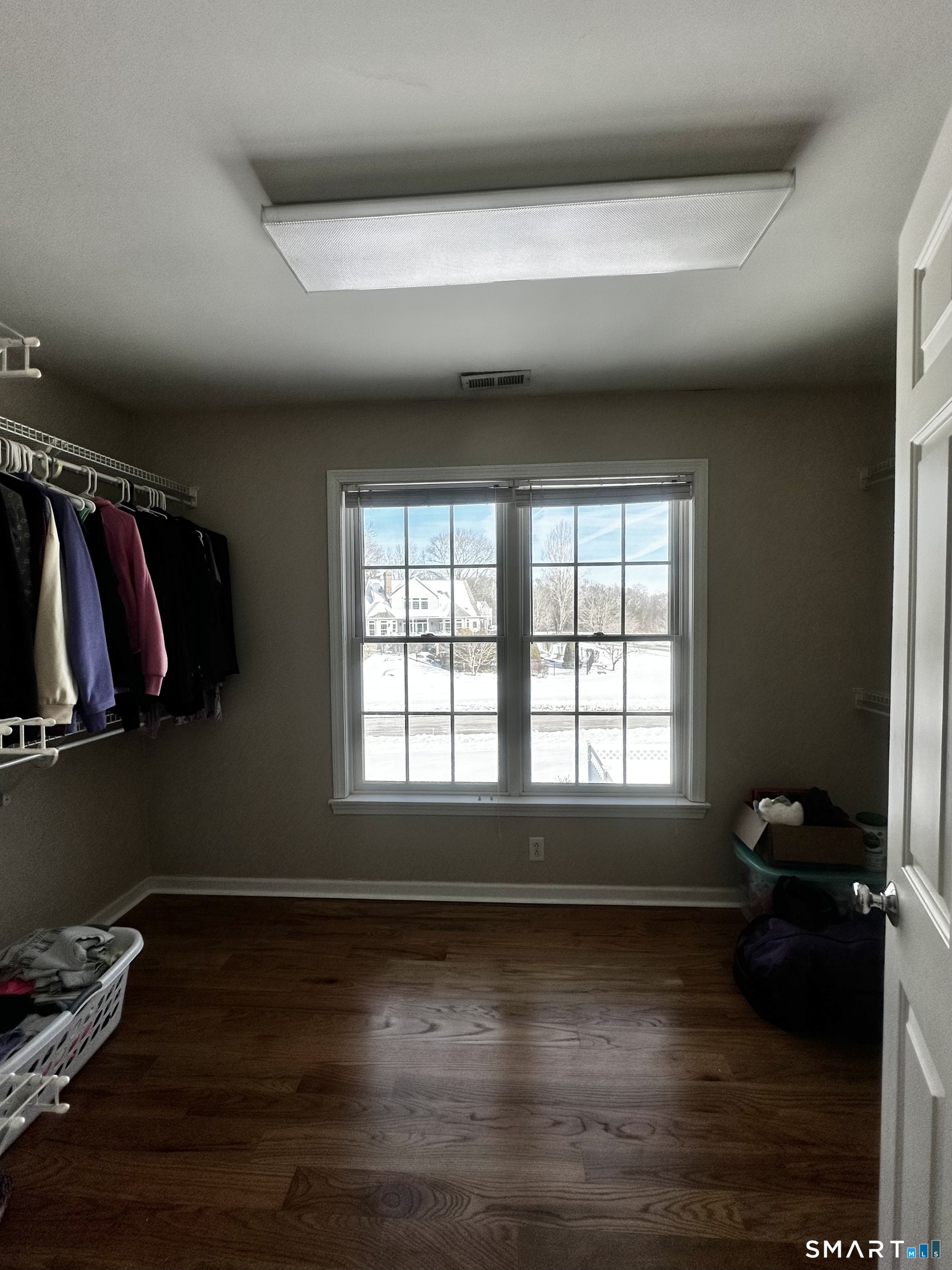 9 Leeward Lane Groton, CT 06340 - Photo 7 of 18 a view of a room with window and wooden floor