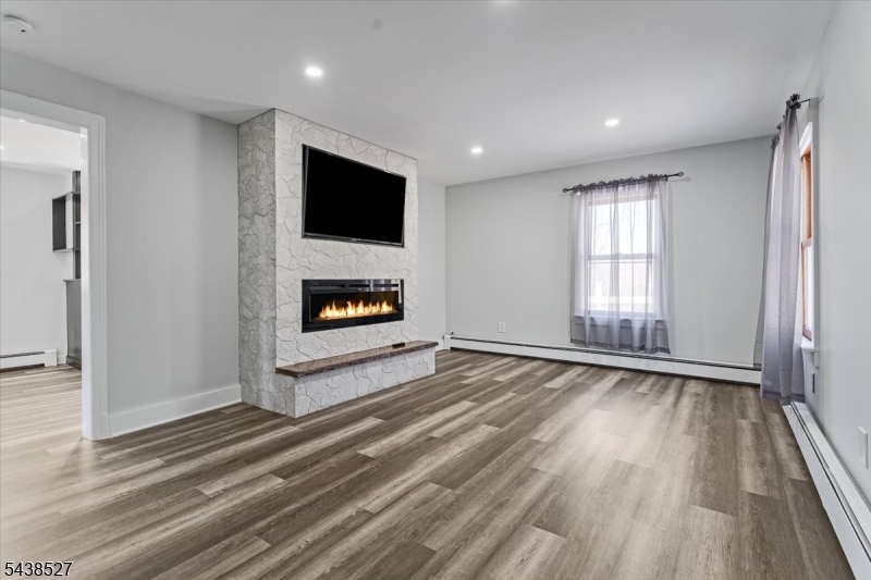 83 Highway 15 Lafayette, NJ 07848 - Photo 18 of 20 an empty room with windows and a fireplace