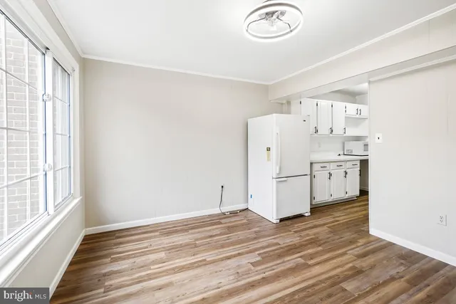 a view of a livingroom with wooden floor