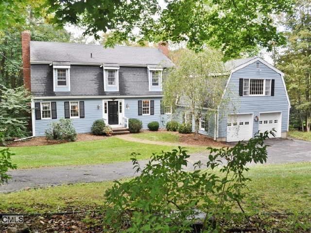 220 West Lane Ridgefield, CT 06877 - Photo 1 of 1 a front view of a house with a yard and porch