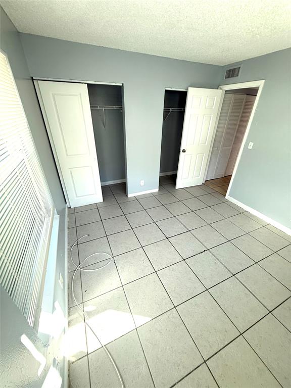 7480 Southwest 10th Court, Unit 1 North Lauderdale, FL 33068 - Photo 9 of 9 a view of a bathroom with a sink and a mirror