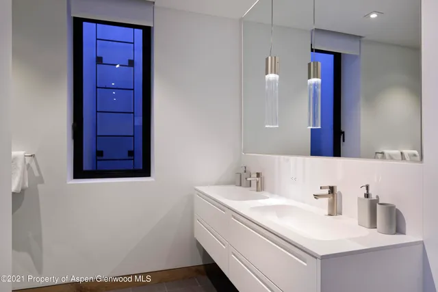 a bathroom with a sink vanity and a mirror