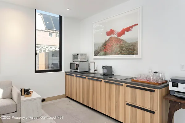 a kitchen with stainless steel appliances a sink and a microwave