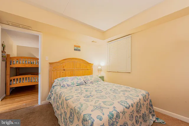 a bedroom with a bed and a walk in closet