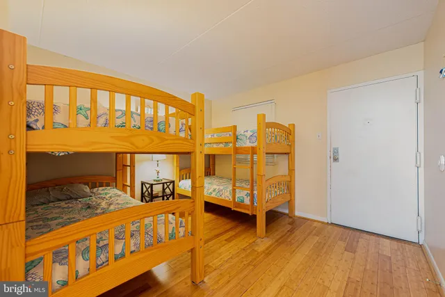 a view of a bedroom with furniture and a window