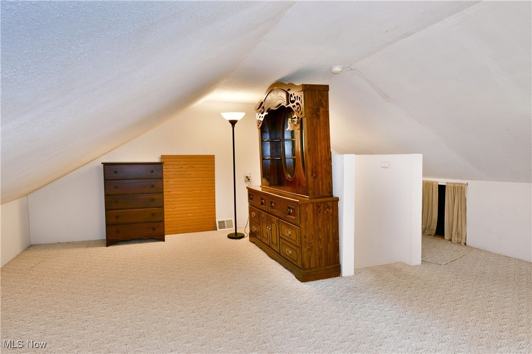 5578 Shaffer Road Northwest Warren, OH 44481 - Photo 35 of 48 Additional living space featuring carpet flooring and vaulted ceiling
