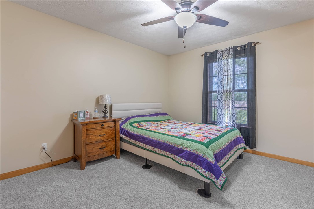 2645 Vance Road St. Paris, OH 43072 - Photo 20 of 35 This cozy bedroom features plush carpeting and a convenient window with elegant drapes.