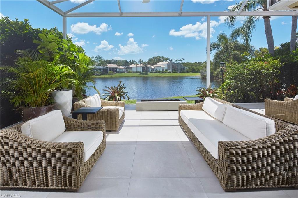 a view of a patio with couches and pool