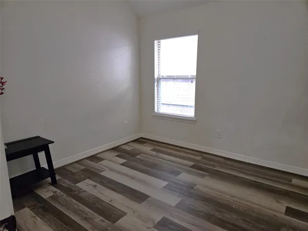 a view of a lake with houses in the background
