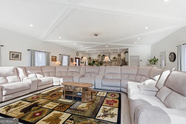 a living room with furniture and a rug