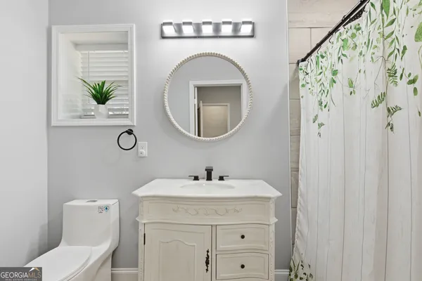 a bathroom with a sink and a shower