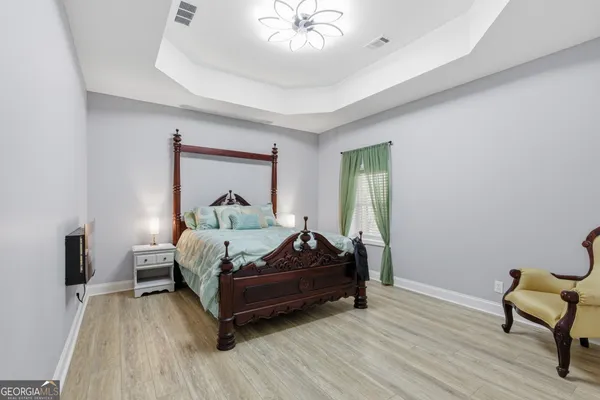 a bedroom with bed and a window